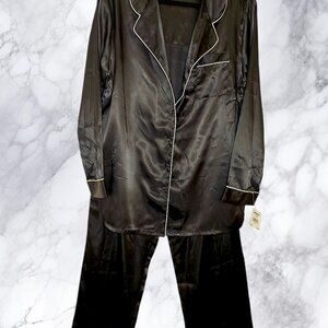 Black satin pajama set with white piping and a soft, silky feel.